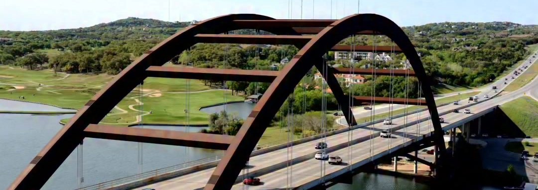 Arched bridge over a lake in the Austin area